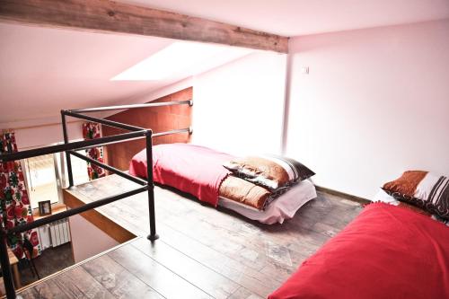 a bedroom with two bunk beds and a staircase at Szmulson in Warsaw