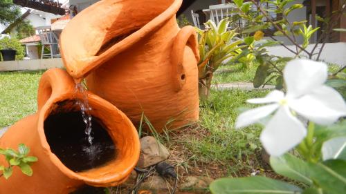 a water fountain in the shape of a flower at Recanto da Praia in Paraty