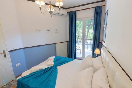 Ένα ή περισσότερα κρεβάτια σε δωμάτιο στο Irene Suites