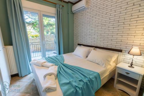 Ένα ή περισσότερα κρεβάτια σε δωμάτιο στο Irene Suites