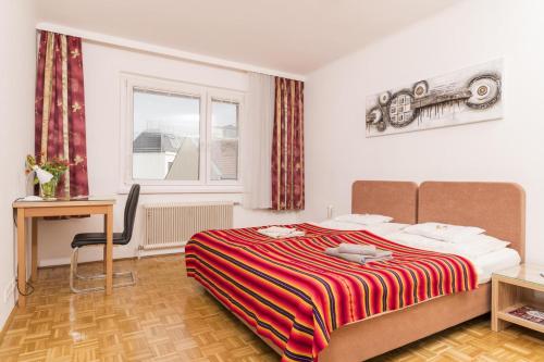 Postel nebo postele na pokoji v ubytování Appartements Ferchergasse