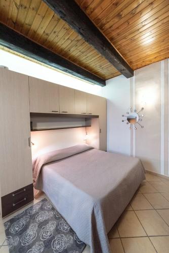 Ένα ή περισσότερα κρεβάτια σε δωμάτιο στο Residenza Pesce D'Oro