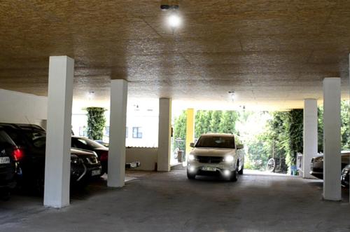 a car parked in a parking garage with cars at Blatský dvůr in Veselí nad Lužnicí