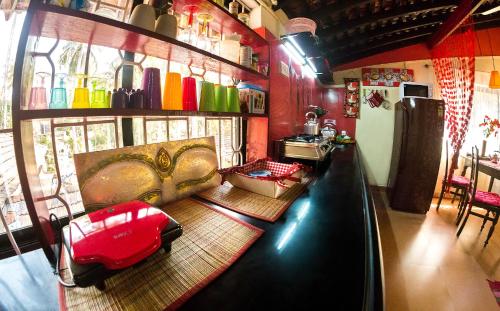 a living room with a couch and a table at Cozy Dream Apartment in Anjuna