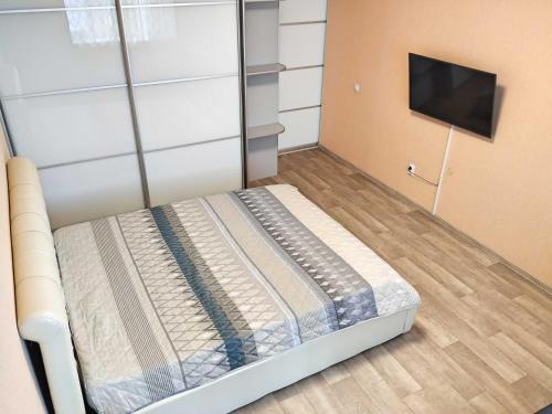 Uma cama ou camas num quarto em Солнечный проезд 25 Аквапарк Источники