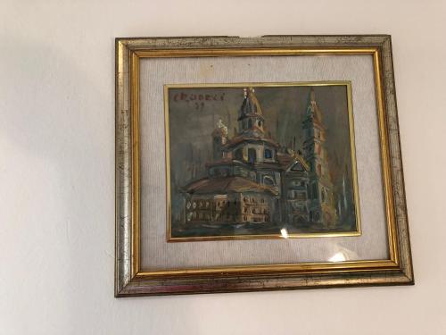 a painting of a building on a wall at Hotel Lukas Vegetarian & Vegan in Viareggio