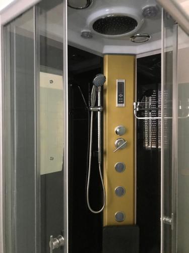 a shower in a bathroom with a glass wall at Appartamento Via Adriatica Nord in Cupra Marittima