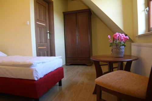 Кровать или кровати в номере Apartamenty U Bandurskich
