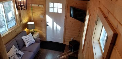 TV a/nebo společenská místnost v ubytování A Tiny Escape