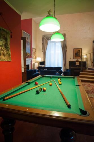 a living room with a pool table with cue balls at RESIDENZA D'ORIA B&B in Foggia