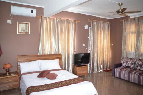 Ein Bett oder Betten in einem Zimmer der Unterkunft Sun Villa Mont Choisy Apartments