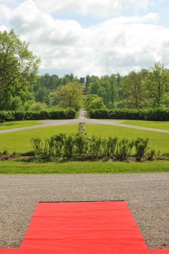 a red carpet on the ground in front of a park at Husby Säteri in Söderköping