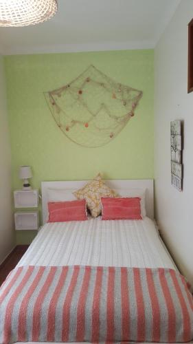 Ένα ή περισσότερα κρεβάτια σε δωμάτιο στο A Casa dos Avós
