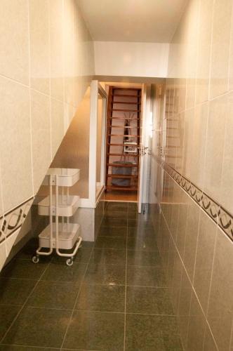 a bathroom with a staircase and a shower in a room at Casa Del Beso in Luarca