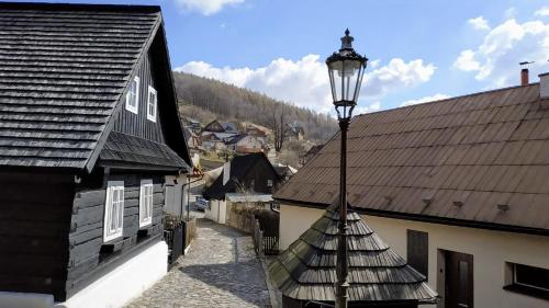 a street light in the middle of a town at Bílá hora Štramberk in Štramberk