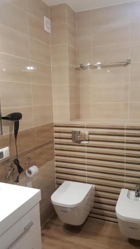 Kúpeľňa v ubytovaní Apartament z widokiem-Bliżej Zdroju