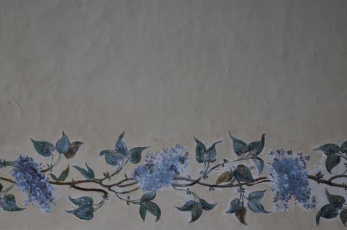 a painting of a branch with blue flowers and birds at Husby Säteri in Söderköping