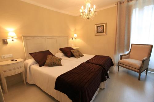 Ένα ή περισσότερα κρεβάτια σε δωμάτιο στο Hotel Poldo