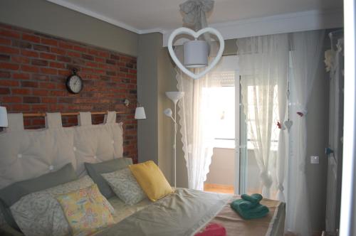 Кровать или кровати в номере Cosy Home Boutique Apartment