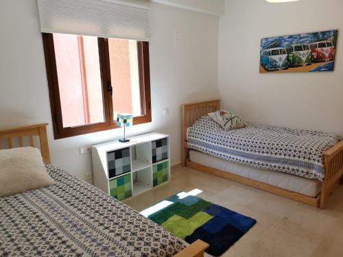 Ένα ή περισσότερα κρεβάτια σε δωμάτιο στο Beautiful penthouse with 3 pools