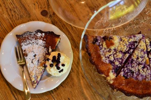two slices of pie on a white plate with a fork at Penzion Panský dům in Kvilda