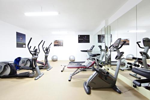 a gym with several cardio bikes and exercise bikes at Sandos El Greco - Adults Only in Portinatx