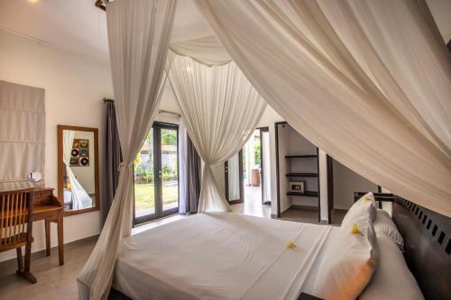 Llit o llits en una habitació de Villa Surga