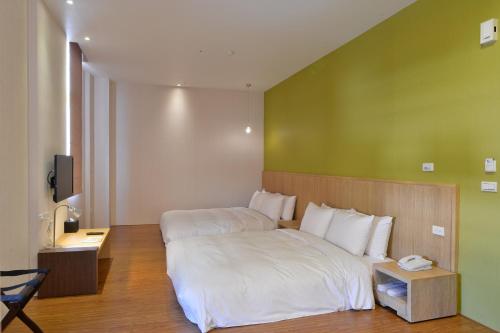 Postel nebo postele na pokoji v ubytování In Young Hotel