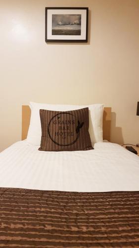 a bed with a pillow that reads thank you at Grains Bar Hotel in Oldham