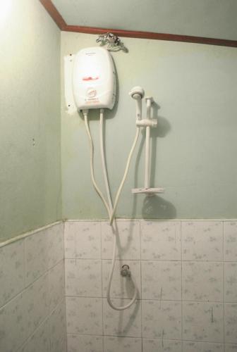 a shower in the corner of a bathroom at Easy Life Bungalows in Haad Yao