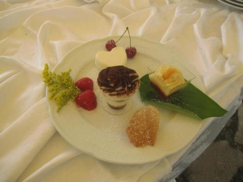 a plate of desserts on a white plate at Hotel Holiday Sul Lago in Bolsena