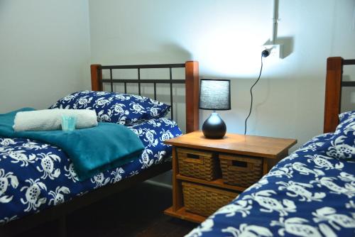 Ένα ή περισσότερα κρεβάτια σε δωμάτιο στο Geraldton Backpackers