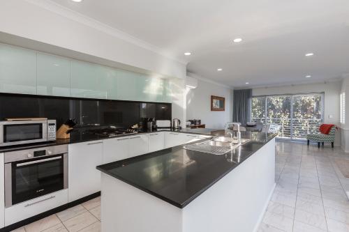 A kitchen or kitchenette at Cottesloe Beach House II