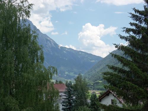 a view of a valley with a mountain at Hotel Schwarzer Adler in Pettneu am Arlberg