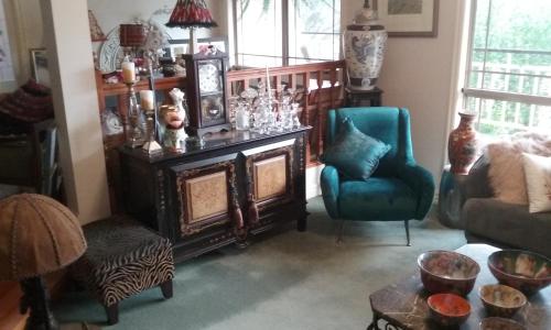 a living room with a couch and a table and chairs at Nicholson BnB and Arts Centre in Nicholson
