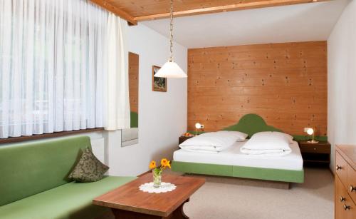 Postel nebo postele na pokoji v ubytování Haus Arnika