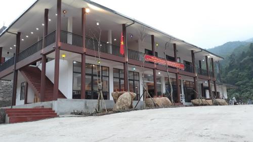 a large building with a flag in front of it at A Sim ba be lake hotel in Bak Kan