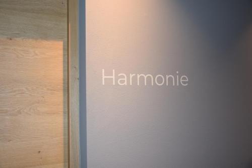a door with the word humanity written on it at Garden-Suite Faselehof in Marlengo