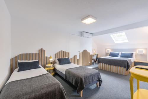 Llit o llits en una habitació de FastHôtel Biarritz Bidart Côte-Basque - Un hôtel FH Collection