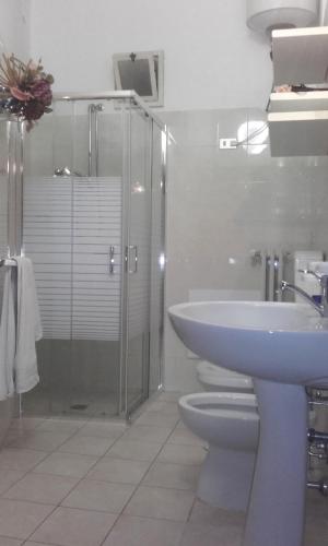 a bathroom with a sink and a toilet and a shower at B&B Lilium Otranto in Otranto
