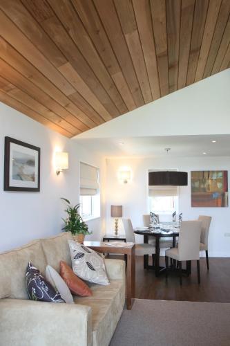 a living room with a couch and a table at The Cornwall Hotel Spa & Lodges in St Austell