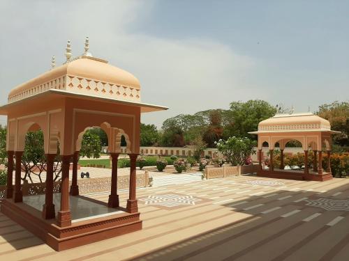 a rendering of a gazebo in a park at Umaid Palace - A Lakeside Resort - 25 minutes from Mehandipur Balaji - 20 minutes from Chand Baori Stepwell Abhaneri & 40 minutes from Bhangarh Fort in Dubbī
