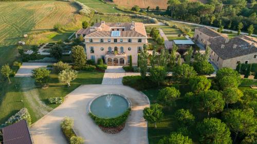 an aerial view of a large house with a swimming pool at Casa Anamaria Hotel in Ollers
