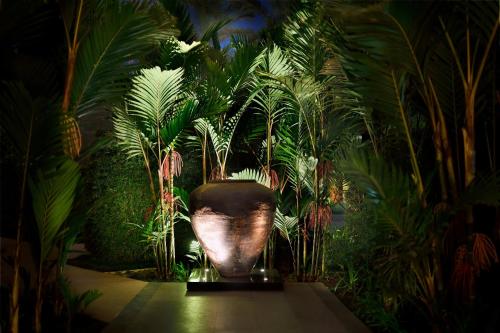 a large vase sitting in a room with plants at Sankara Nairobi, Autograph Collection in Nairobi