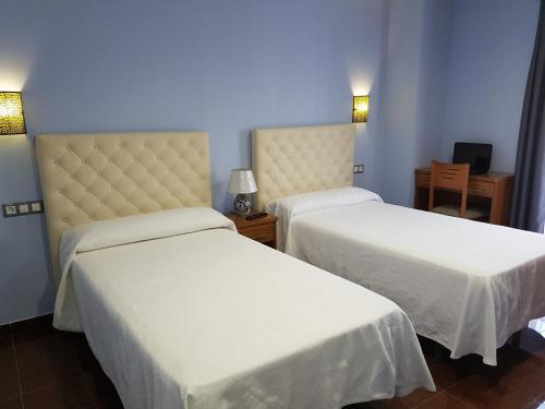 Katil atau katil-katil dalam bilik di HOSTAL CAMELOT
