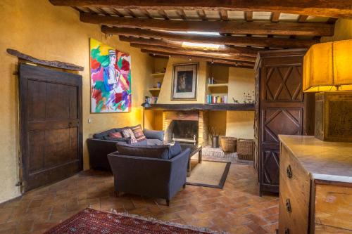 a living room with a couch and a fireplace at Can Felip Apartments in Palafrugell