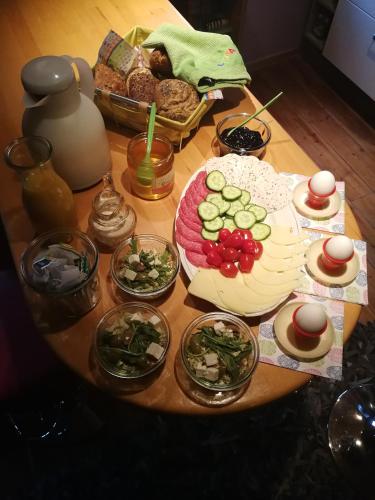 a table topped with plates of food on a table at Winzerhaus Rissweg 15 in Dresden