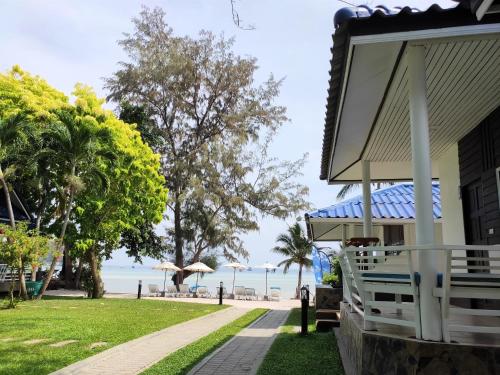 a house with a view of the beach at Assava Dive Resort - SHA Plus in Koh Tao