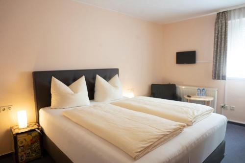 Katil atau katil-katil dalam bilik di Mittelrhein Pension