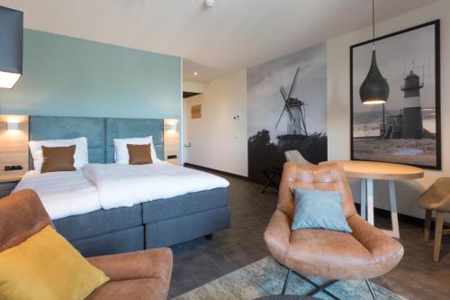Een bed of bedden in een kamer bij Hotel Kaap West I Kloeg Collection